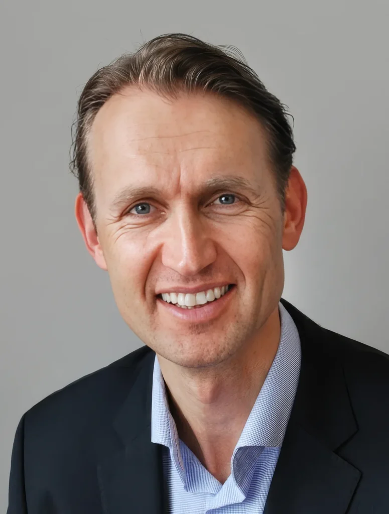 Portrait of a smiling man in a suit.