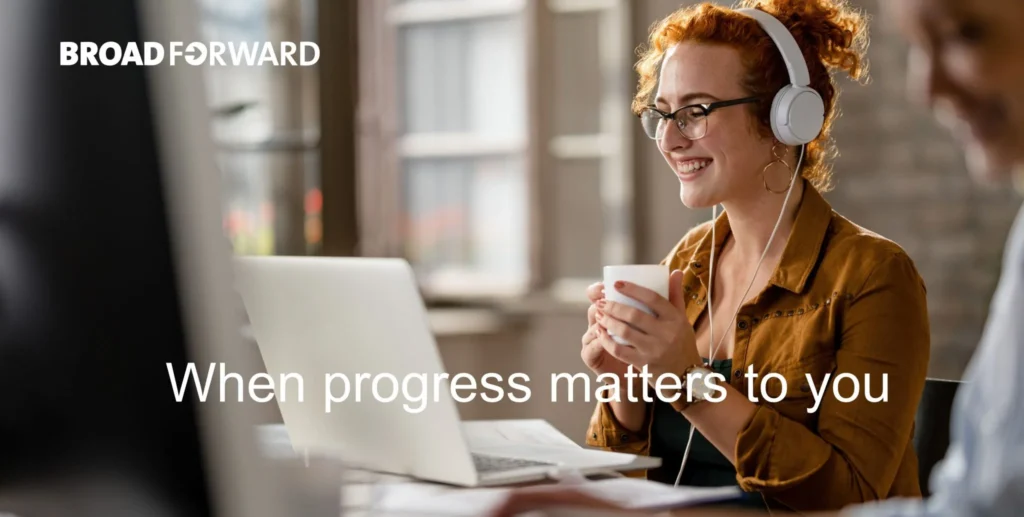 A woman wearing headphones smiles while working on a laptop, with the text "When progress matters to you" displayed.